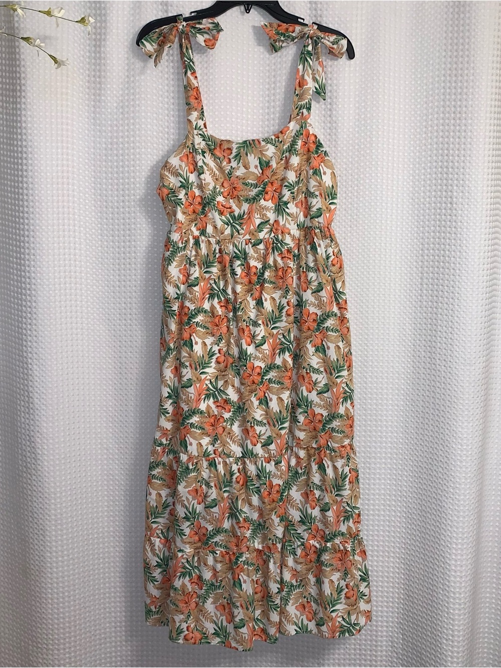 Skies Are Blue orange and green floral linen blend midi dress with tie straps.
